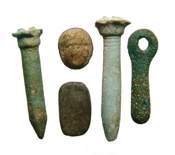 A group of 5 Roman-Egyptian objects: A group of 5 Roman-Egyptian objects. Lot includes a pair of faience papyrus sceptre amulets, Late Period, c. 664 - 30 BC, a serpentine scaraboid-shaped bead from the same period, a Roman green glass p