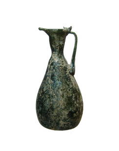 A nice Roman olive green glass pitcher: A nice Roman olive green glass pitcher, Eastern Mediterranean, 4th - 5th Century AD, a lovely form, the body ovoid with indented base, the narrow neck with very well-formed pouring mouth and single