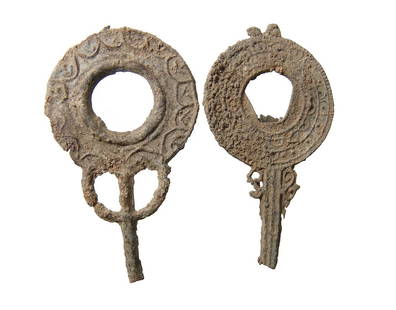 A pair of Roman lead votive hand mirrors: A pair of Roman lead votive hand mirrors, c. 1st - 3rd Century AD, each with molded geometric decoration and well-preserved with a light tan oxide patina. Both about 3 1/2 in (8.9 cm). Ex Orange