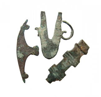 A lot of 3 Near Eastern bronze objects: A lot of 3 Near Eastern bronze objects. Each appears to be part of an applique or similar and could date anywhere from the mid-1st Millennium BC to the 1st Millennium AD. Largest 2 5/8 in (6.8 cm) in