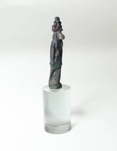 Egyptian cobalt blue glass amulet of the god Khnum: A nice Egyptian cobalt blue glass amulet of the god Khnum, Late Period, c. 664 - 332 BC, the deity is depicted wearing an elaborate headdress and short kilt. The glass well-preserved with a few spots