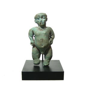 A large Egyptian faience figure of Pataikos: A large Egyptian faience figure of Pataikos, Late Period - Ptolemaic, c. 664 - 30 BC, depicted nude, with plump rounded features and light blue color. Pataikos was a phylactic deity worshiped