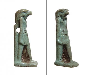 A lovely Egyptian faience glazed amulet of Horus: A lovely Egyptian faience glazed amulet of Horus, Late Period, c. 664 - 332 BC, depicted standing with back plinth and integral base, wearing a striated kilt, hands at his side; suspension hole just