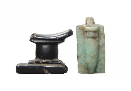 A pair of Egyptian stone amulets, Late Period: A pair of Egyptian stone amulets, Late Period, c. 664 - 332 BC, including a nice hematite headrest amulet, 20 x 15 mm, and a feldspar amulet of a Waji or papyrus sceptre on a rectangular plaque, 20 x