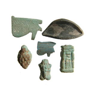 A lot of Egyptian amulets and an inlay: A lot of Egyptian amulets and an inlay. A nice mixed group containing a pair of Eye of Horus amulets, Late Period, c. 664 - 332 BC, the smaller in blue frit with nice details, 24 x 20 mm & 15 x 13.5 m