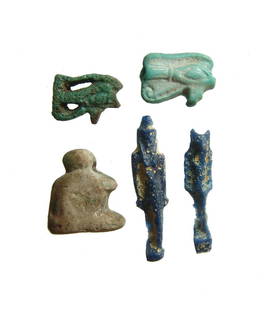 Lot of 5 Egyptian glass & faience amulets, Late Period: A lot of 5 Egyptian glass & faience amulets, Late Period, c. 664 - 332 BC, including a pair of molded blue glass amulets of goddesses, one Bastet, a pair of faience Eye of Horus amulets, each with nic