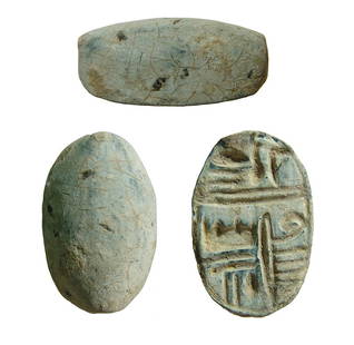 An Egyptian steatite scaraboid: An Egyptian steatite scaraboid, New Kingdom - 3rd Intermediate, c. 1570 - 664 BC, the back domed and smooth, on base the phrase 'Master of the Two Lands', a way to refer to the pharaoh. 24 x 12 mm.