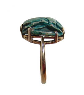 An Egyptian scarab set into a nice gold ring: An Egyptian scarab set into a nice gold ring. The scarab, 3rd Intermediate, c. 1075 - 664 BC, the body nicely carved with brilliant blue glaze, the base with pseudo cartouche flanked by signs of luck