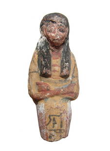 An Egyptian polychrome terracotta ushabti: An Egyptian polychrome terracotta ushabti, later New Kingdom, c. 1200 - 1075 BC, mummiform, wearing tripartite wig and broad collar, arms folded across chest, hands clutching hoes and a vertical
