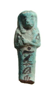 An Egyptian bicolor faience ushabti, Dynasty 21: An Egyptian bicolor faience ushabti, 3rd Intermediate Period, Dynasty 21, c. 1075 - 945 BC, depicted mummiform, wearing tripartite wig, arms folded at chest and holding a hoe in either hand. At back
