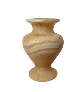 A lovely Egyptian banded alabastron, New Kingdom: A lovely Egyptian banded alabastron, New Kingdom, c. 1570 - 1070 BC, carved from beautiful banded alabaster, the body of inverted piriform shape with flared pedestal foot, short neck and wide flat