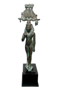 Beautiful Egyptian bronze figure of a striding: A beautiful Egyptian bronze figure of a striding Harpokrates, Late Period, c. 664 - 332 BC, depicted nude on integral base and wearing Nemes head cloth with uraeus and the Hem Hem Crown, right hand