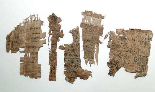 A group of 5 ancient papyrus fragments from Egypt: A group of 5 ancient papyrus fragments from Egypt. Lot includes fragments containing Demotic, Greek and Coptic script. Some areas of clear text with some weathering and deposits. Largest piece 4 3/4