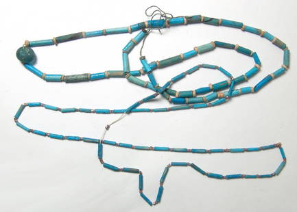 A pair of Egyptian faience bead necklaces, Late Period: A pair of Egyptian faience bead necklaces, Late Period, c. 664 - 30 BC, the first with a heavy Roman green glass bead as a pendant and comprised of heavy faience tubular beads in shades of blue inters