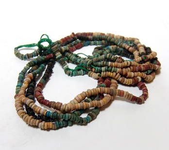 Multi-strand necklace of Egyptian faience disc beads: A long multi-strand necklace comprised of Egyptian faience disc beads, Late Period, c. 664 - 30 BC, the beads are of exceptional quality, well-preserved, and in various colors. L: 28 in (71 cm). Ex