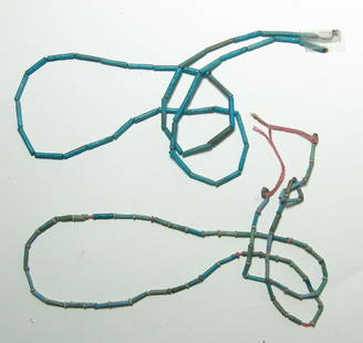 Two strands of Egyptian faience beads: Two strands of Egyptian faience beads, Late Period - Ptolemaic, c. 664 - 30 BC, comprised of mainly light to pale blue faience tubular beads, one strand interspersed with creme colored disc beads.