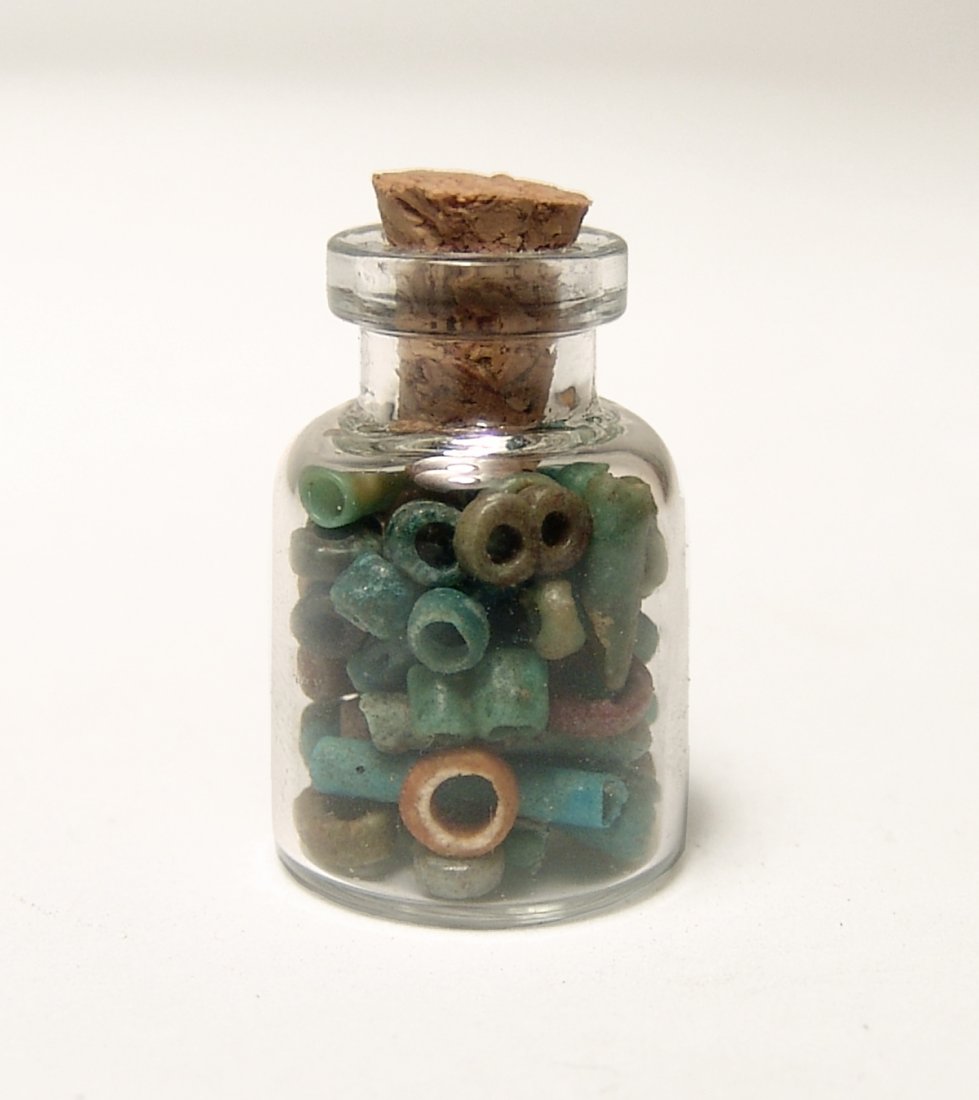 A small bottle filled with Egyptian faience beads (1 of 2)