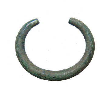 A nice Near Eastern bronze bracelet: A nice Near Eastern bronze bracelet, c. 1000 - 600 BC, crescent-shaped and quite solid with round profile, tapering at each end. 2 7/8 x 2 3/8 in (7.3 x 6 cm). Nicely patinated. Ex German private