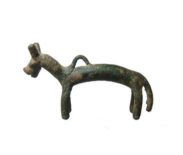 A Western Asiatic bronze figure of a horse: A Western Asiatic bronze figure of a horse, c. 1200 - 800 BC, with long slender body and legs and long tail. The head is detailed, the flattened muzzle with mouth, domed eyes and alert ears; at the