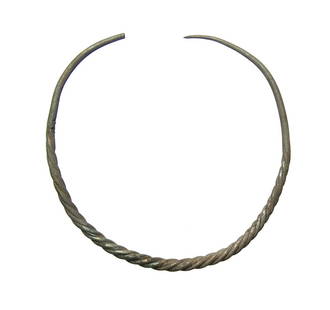 A nice Eastern Celtic silver torque, La Tene: A nice Eastern Celtic silver torque, La Tene, c. 4th - 3rd Century BC, comprised of pulled then twisted silver wire with plain ends tapering to a point. 4 3/4 x 4 3/4 in (12 in). Ex Orange County