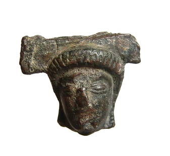 A Greek bronze head of a woman or goddess: A Greek bronze head of a woman or goddess, c. 6th - 5th Century BC, with archaic-style eyes and tightly curled or woven hair, remnants of a horizontal fragment of whatever vessel or object it was
