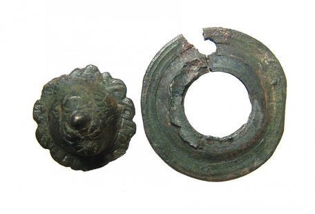 Roman bronze applique in the form of a facing lion: A nice Roman bronze applique in the form of a facing lion's head, c. 1st - 4th Century AD, mounted on a round shield. Likely an applique for a chest or piece of provincial furniture. Originally made