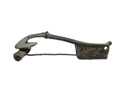 A large Roman bronze trumpet brooch: A large Roman bronze trumpet brooch, 1st - 2nd Century AD, in choice condition with original coil, pin and catch. L: 4 3/8 in (11.1 cm). Nice brown patina. Ex Southern California private collection.
