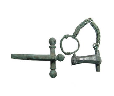 A pair of attractive Roman bronze fibulae: A pair of attractive Roman bronze fibulae. The first a knee brooch, 2nd Century AD, with original bronze chain remaining, (3 x 10 cm), and the other a nice crossbow fibula, 3rd Century AD, just