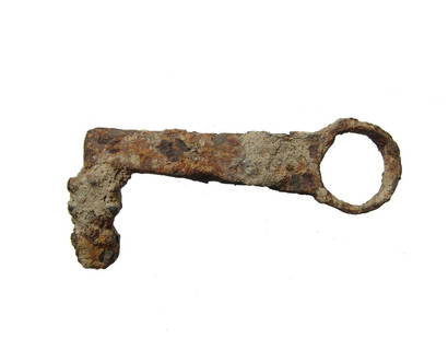 A large Roman iron key, 1st - 3rd Century AD: A large Roman iron key, 1st - 3rd Century AD, 'L-shaped' with circular ring at terminal and knobbed, irregular end to open a pin tumbler lock. L: 3 in (7.6 cm). Oxide patina with encrustation. Ex