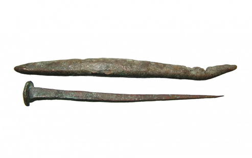 A Roman bronze nail and a bronze ingot: A Roman bronze nail and a bronze ingot, c. 1st - 4th Century AD, the nail with square profile and rounded head, L: 4 1/2 in (11.4 cm), and the ingot with even brown patina, L: 5 1/8 in (13 cm). Ex