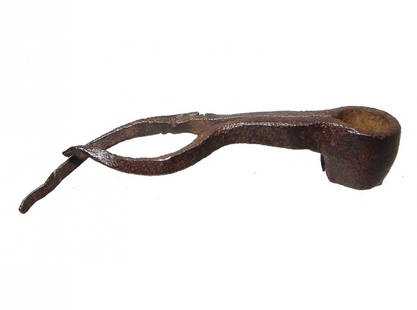 A Medieval iron pick-type tool: A Medieval iron pick-type tool, c. 10th - 15th Century, formed from a single strip of iron with attachment shaft for a handle, the two narrowing ends now a bit distorted. L: 4 1/4 in (10.8 cm). Nice