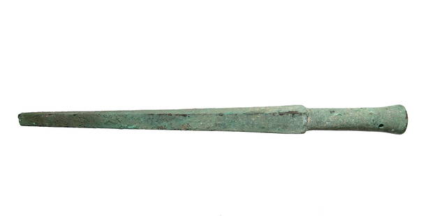 A Near Eastern bronze spike butt: A Near Eastern bronze spike butt, c. 1200 - 600 BC, the tapered point with square profile and round mounting shaft with 2 rivet holes. L: 13 1/4 in (33.6 cm). Nice green brown patina. Ex Philadelphia