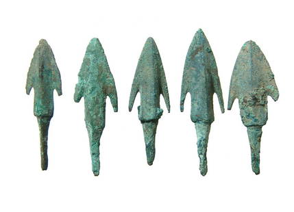 A nice lot of 5 Near Eastern bronze arrowheads: A nice lot of 5 Near Eastern bronze arrowheads, c. 1000 - 600 BC, each with triangular blade with pronounced midribs, the substantial stems with long tang for mounting into a shaft. Largest 1 7/8 in (