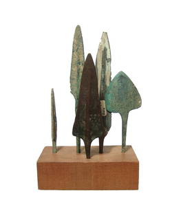 A group of 5 Near Eastern bronze arrow points: A group of 5 Near Eastern bronze arrow points, c. 1200 - 600 BC, various types are represented and all attractive patinated and mounted in an old rectangular wood block. Largest 4 3/4 in (12 cm) in