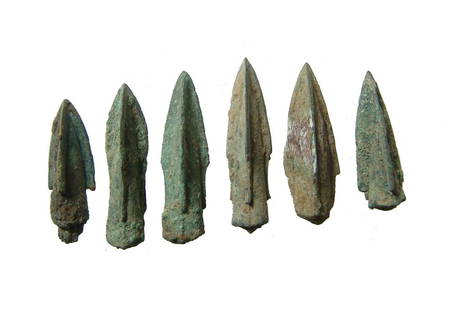 6 Chinese bronze arrow or ballista points, Qin Dynasty: A group of 6 Chinese bronze arrow or ballista points, Qin Dynasty, c. 255 - 206 BC, each trilobate with remnants of the long bronze or iron tangs these types possessed. Longest 1 3/8 in (3.5 cm). Ex