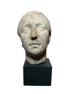 A Roman Republic marble head of a man: A Roman Republic marble head of a man, c. 1st Century BC, carved in the veristic style of the late Republic, his eyes wide and realistic facial details noted. The head is well-preserved with