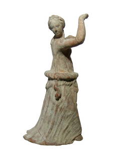 A charming Greek terracotta figure of a dancing girl: A charming Greek terracotta figure of a dancing girl, Tarentine, c. 4th - 3rd Century BC, depicted at the moment before she performs a twirl, wearing chiton and himation, a rolled band around her