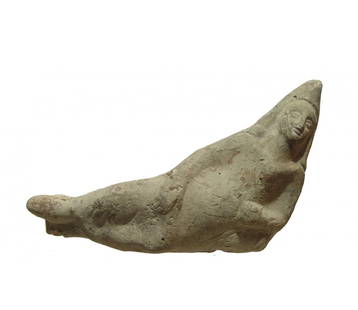 A Seleucid-Parthian terracotta figure: A Seleucid-Parthian terracotta figure, c. 3rd - 2nd Century BC, in characteristic banqueter pose wearing pointed cap and long robes, left arm resting on a pillow right arm draped over legs. L:6 in