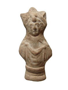A Parthian terracotta figure of a priest or deity: A Parthian terracotta figure of a priest or deity, c. 1st - 2nd Century AD, with large domed adornment at center of the forehead. H: 4 1/2 in (11.4 cm). Nicely detailed with light surface deposits.