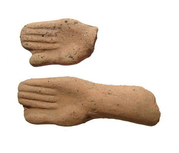 Pair of Etruscan terracotta votives in form of hands: A pair of Etruscan terracotta votives in the form of human hand, c. 4th - 3rd Century BC, each molded with good detail. L: 4 1/8 in (10.4 cm) & 2 3/8 in (6 cm). Light deposits. Ex collection of Moshe