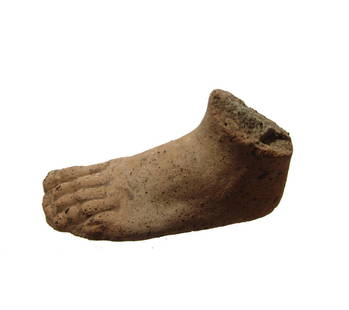 A well-detailed Etruscan terracotta votive foot: A well-detailed Etruscan terracotta votive foot, 3rd - 2nd Century BC, nicely modeled in micaceous clay, the bottom flat.1 5/8 x 3 in (4.2 x 7.6 cm). Ex collection of Moshe Dayan, Israel; Ex Harvith
