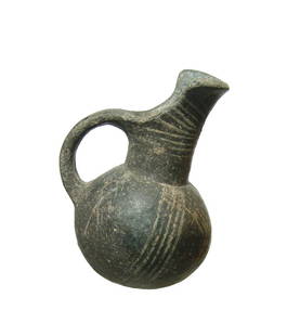 A Yortan culture black-ware jug, Early Bronze Age II: A Yortan culture black-ware jug, Anatolia, Early Bronze Age II, c. 2700 - 2400 BC, hand-modeled, with rounded body, pouring spout and single handle. The nicely burnished gray surfaces are decorated