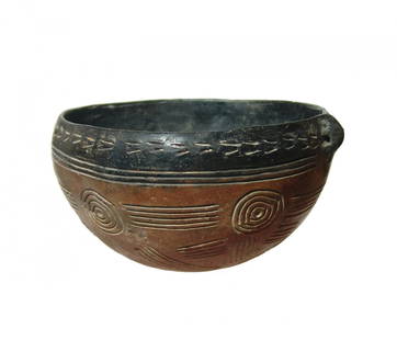 A choice Cypriot black topped red polished ware bowl: A choice Cypriot black topped red polished ware bowl, c. 2100 - 1900 BC, with rounded bottom and small pierced lug handle for suspension. The outer surfaces are decorated with horizontal bands and
