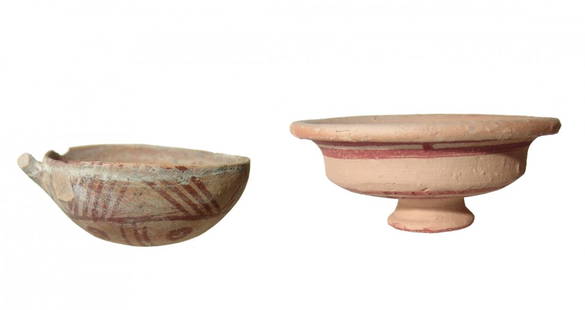 A Cypriot drinking cup and pedestal dish: A Cypriot drinking cup and pedestal dish. The Cypriot white painted ware drinking cup, c. 1725 - 1650 BC, with rounded bowl and remains of loop handle, the bottom painted with attractive geometric