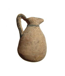 Cypriot bichrome ware juglet, Cypro-Archaic I: A Cypriot bichrome ware juglet, Cypro-Archaic I, c. 750 - 600 BC, the ovoid body topped by a trefoil mouth and single handle. The vessel is adorned with dark brown slip including a swastika-type
