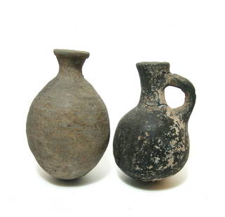 An ancient bottle and a juglet from the Holy Land: An ancient bottle and a juglet from the Holy Land, c. 800 - 500 BC, the first is a grey-ware bottle, the ovoid body with narrow neck and flared mouth, H: 4 1/8 in (10.4 cm), the second is a black-ware