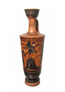 A beautiful Greek black-figure lekythos: A beautiful Greek black-figure lekythos, c. 500 - 460 BC, featuring a siren holding a lyre standing atop a mound, a nude male figure stands to right before, looking back. On either side of the pair