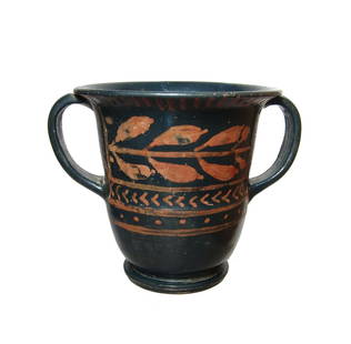 A very nice Greek red-figure skyphos: A very nice Greek red-figure skyphos, 4th Century BC, with two vertically oriented handles and decorated with a panel containing a laurel band above angled lines and pellets, all separated with