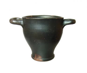 A nice Greek black-ware skyphos, 4th Century BC: A nice Greek black-ware skyphos, 4th Century BC, with ring foot and horizontal loop handles, the surfaces a nice glossy black. 4 1/8 in x 6 1/2 in (10.4 x 16.5 cm). Light surface deposits and an