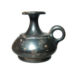 A nice Greek black-glazed squat aryballos: A nice Greek black-glazed squat aryballos, 4th Century BC, with high level of metallic sheen remaining. 3 3/8 in (8.6 cm). A pleasing example! Ex Indianapolis private collection.